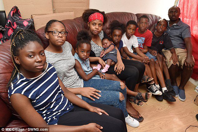 Arnold Mballe Sube and his wife Jeanne, both 33, currently share their three-bedroom, end-of-terrace home in Luton with their eight young children but describe it as 'terrible'