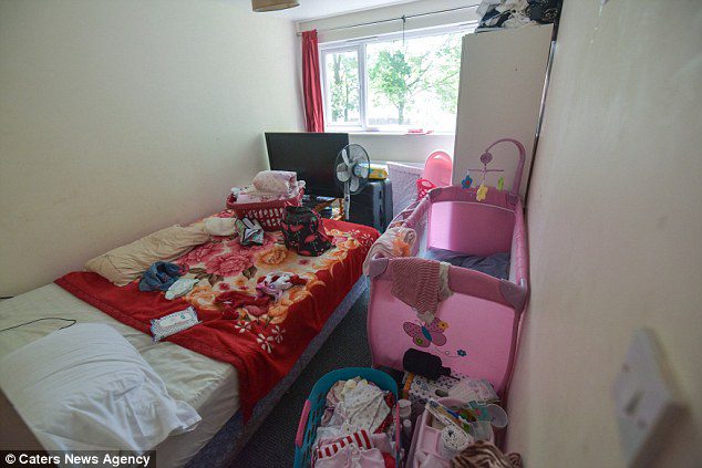 The main bedroom Arnold Mballe Sube and his wife Jeanne, 33, share with their baby 
