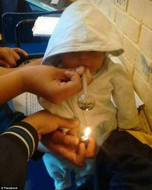 baby smoking ice pipe 